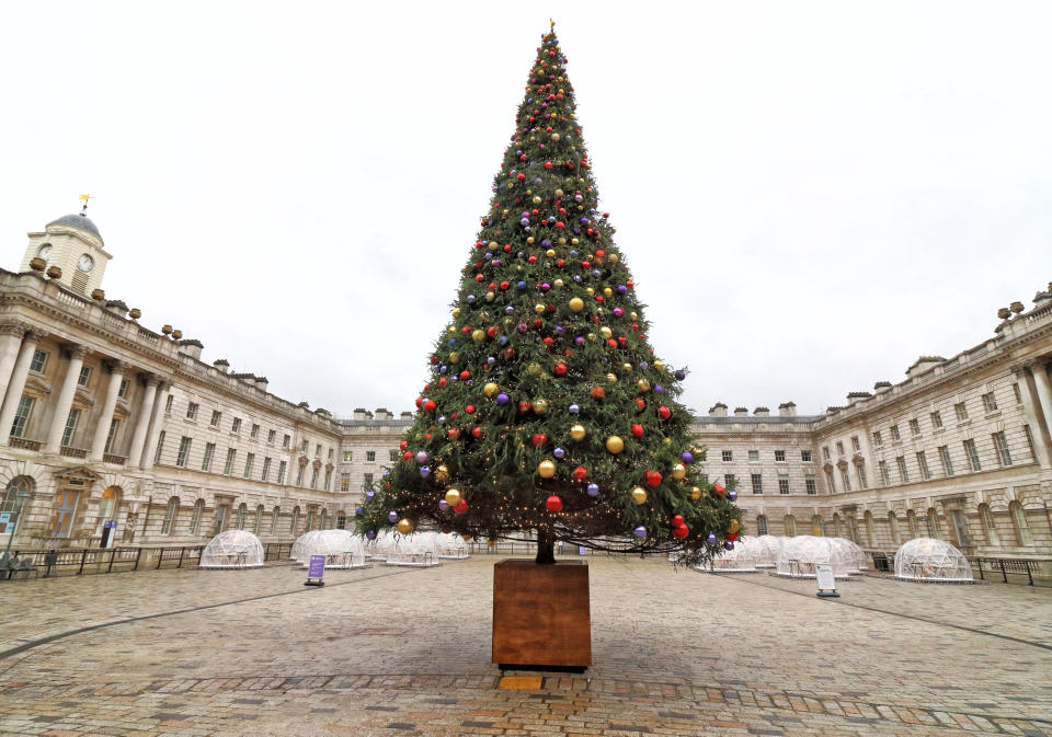 LONDON, UNITED KINGDOM - 2020/12/03: View of a Christmas tree in the courtyard.
London's hub of creative arts, Somerset House reopens after the end of the second coronavirus lockdown and unveils its 2020 Christmas tree along with some pop up dining domes, forming a new festive foodie experience. (Photo by Keith Mayhew/SOPA Images/LightRocket via Getty Images)