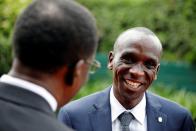 Kipchoge, the marathon world record holder, speaks with a fan after an Interview with Reuters at the state house in Nairobi