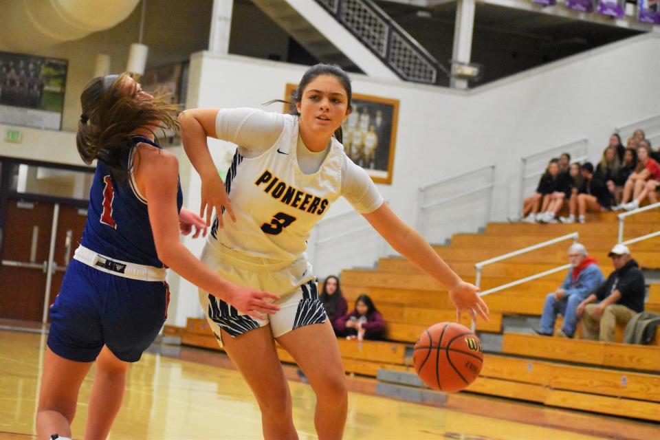 Mooresville's Addison VanWanzeele (3) fights through contact by Martinsville's Marina Rautenkranz (1) during the Pioneers' sectional matchup against the rival Artesians on Feb. 3, 2023.