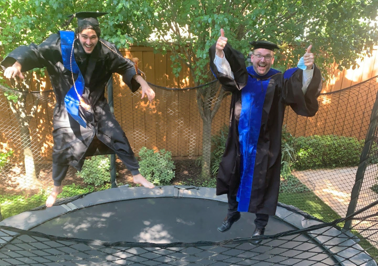 Texas principal Scott Rudes (R) hand-delivered diplomas to the homes of all 240 graduating seniors. (Photo: Courtesy of Booker T. Washington HSPVA)