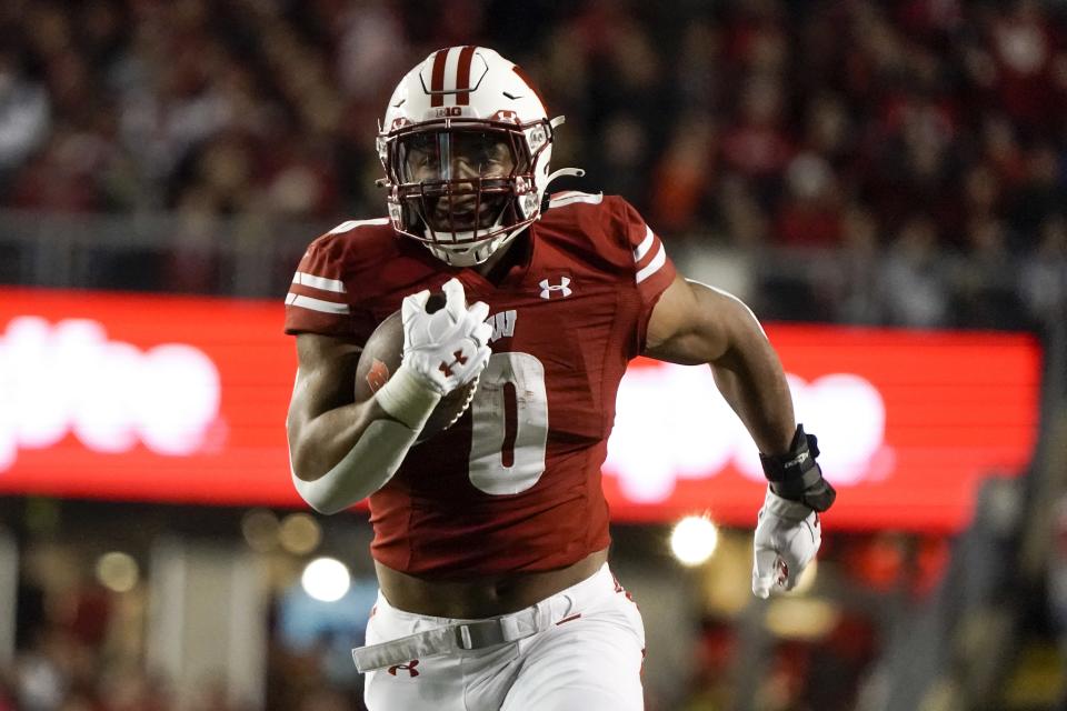 Wisconsin's Braelon Allen runs for a touchdown during the first half of an NCAA college football game against Army Saturday, Oct. 16, 2021, in Madison, Wis. (AP Photo/Morry Gash)