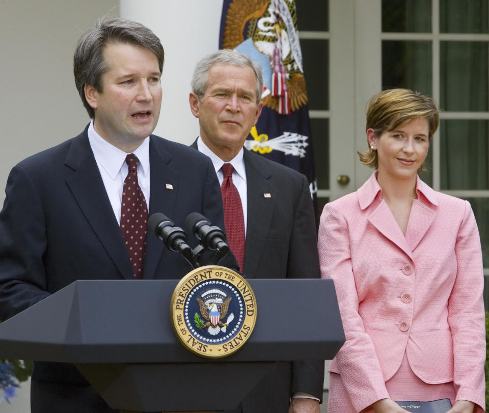 Brett Kavanaugh with then-President George W. Bush and wife Ashley Kavanaugh in June 2006. (Photo: PAUL J. RICHARDS via Getty Images)