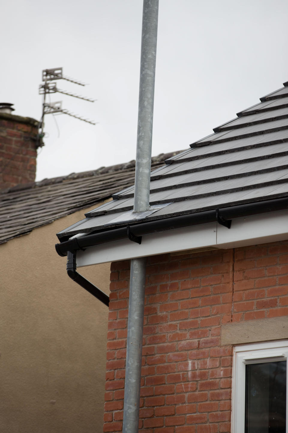 A house that sparked controversy as the lamppost goes through the fascias. 