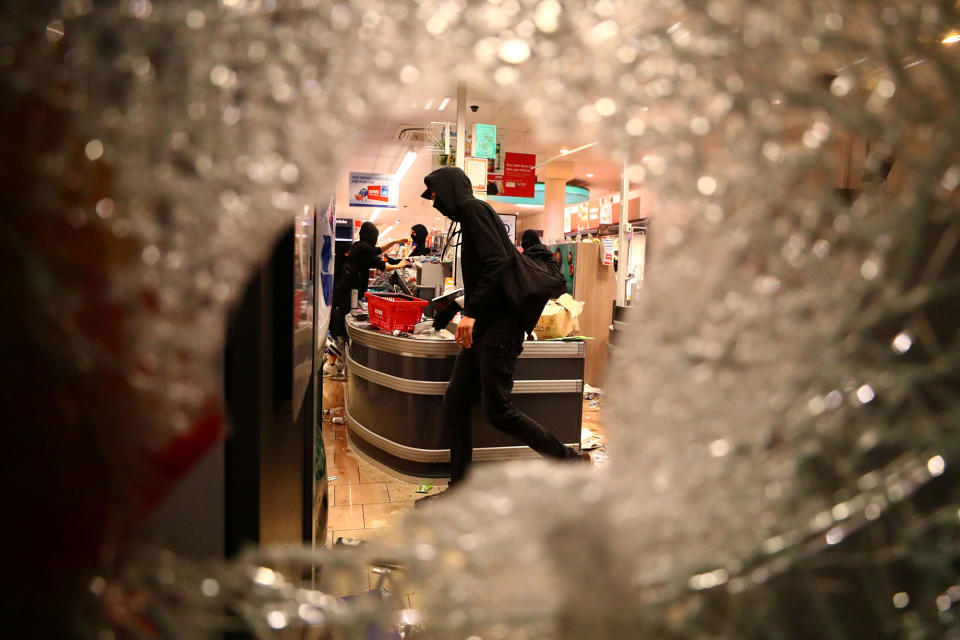 <p>A shop is looted during anti-G20 protests on the first day of the G20 summit in Hamburg, Germany, July 7, 2017. (Pawel Kopczynski/Reuters) </p>