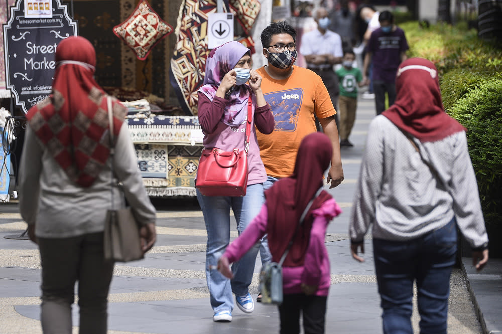 People wearing face masks July 11, 2020. Health director-general Datuk Dr Noor Hisham Abdullah today advised Malaysians to wear three-ply face masks as they provide the most effective protection against Covid-19. — Picture by Miera Zulyana