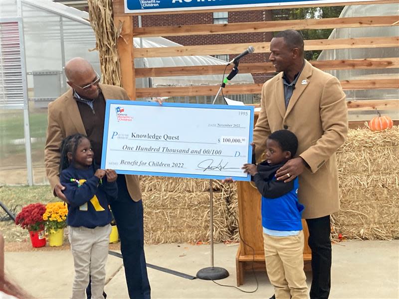 Eric Brown, Vice President and General Manager of the Valero Memphis Refinery, presents a check of $100,00 to Knowledge Quest.