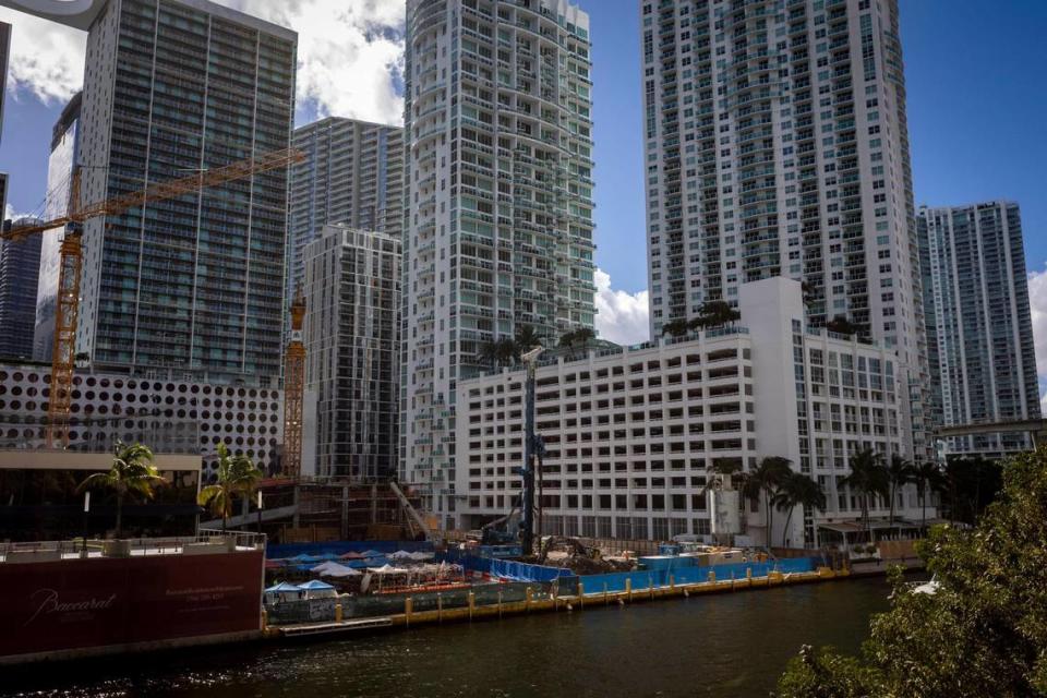 Archaeologists work under tarps, center, on excavation of an extensive prehistoric indigenous site on the Miami River in Brickell where developer Related Group is building two new towers. At extreme left is a corner of 444 Brickell Avenue, which Related plans to demolish to make way for a third tower. Miami’s historic preservation board declared the lot an archaeological landmark, but that won’t stop Related from building on it.