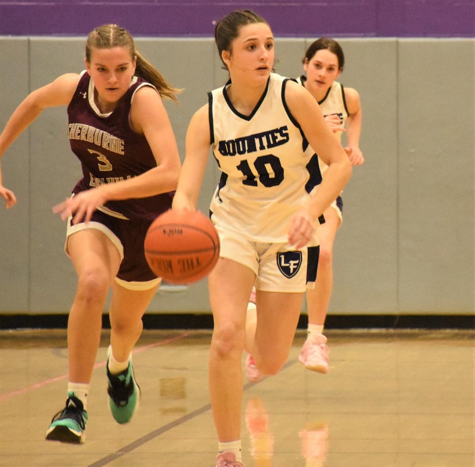 Adriana Izzo leads the Little Falls Mounties up the floor during the second half of a Section III playoff game against Sherburne-Earlville Tuesday.