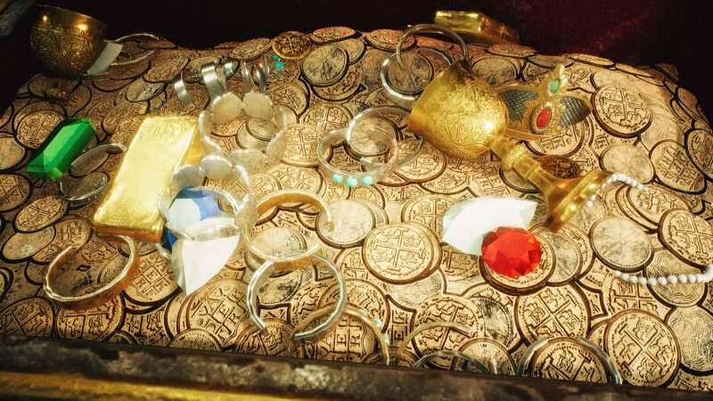 A chest of pirate treasure, including gold and jewels.