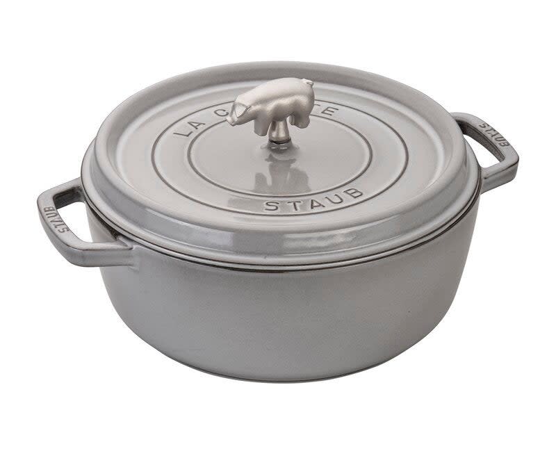 Staub cast iron cocotte with lid, featuring two handles and a top knob