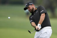 Shane Lowry, of Ireland, chips to the green on the fifth hole during the second round of the RBC Heritage golf tournament, Friday, April 19, 2024, in Hilton Head Island, S.C. (AP Photo/Chris Carlson)