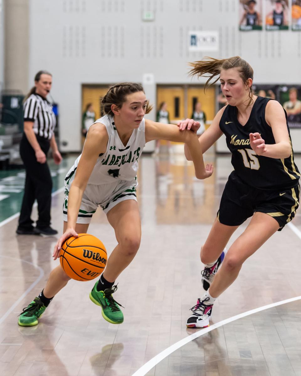 Fossil Ridge girls basketball player Kaycee Steinke drives past a defender during a game against Monarch on Jan. 20 at Fossil Ridge High School in Fort Collins.