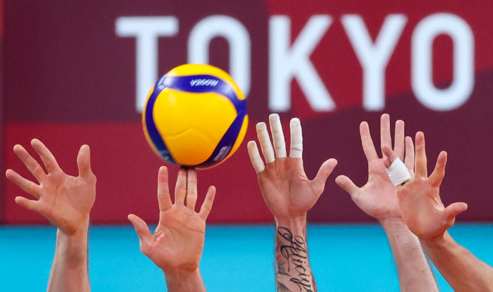 <p>A men's volleyball semi-final match between Brazil and the ROC Team during the Tokyo 2020 Summer Olympic Games, at the Ariake Arena. Stanislav Krasilnikov/TASS (Photo by Stanislav Krasilnikov\TASS via Getty Images)</p> 