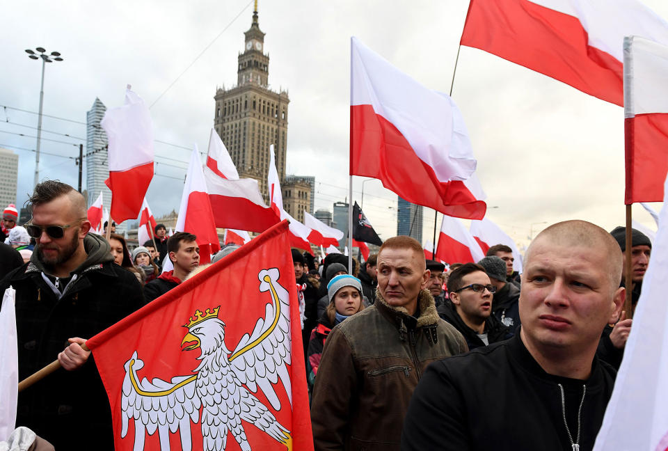 <p>Demonstrators burn flares and wave Polish flags during the annual march to commemorate Poland’s National Independence Day in Warsaw on Nov. 11, 2017. (Photo: Janek Skarzynski/AFP/Getty Images) </p>