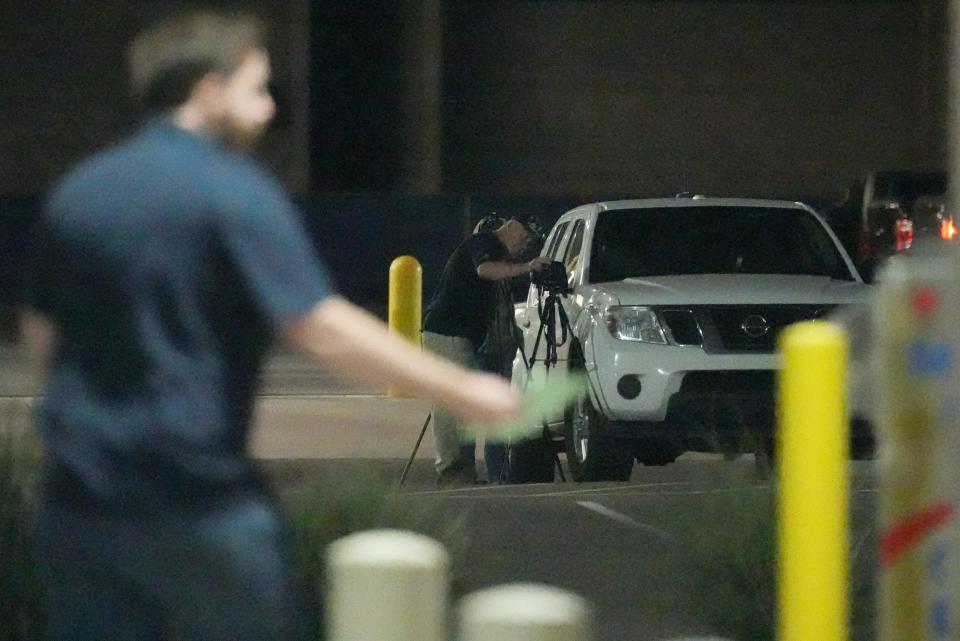 A man watches and records a person dropping off a ballot drop box in Mesa on Oct. 26, 2022. Several voting rights groups are asking federal judges to stop ballot box observers from staking out Arizona voting locations.