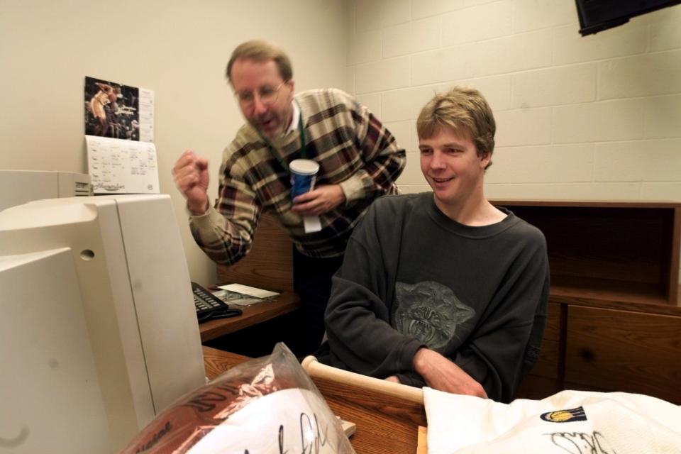 David Benner with Rik Smits as they worked to raise money for a youth center in 1999.