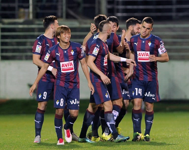 Eibar's players celebrate after scoring a goal during a Spanish La Liga match against Celta Vigo, at the Ipurua Municipal Stadium in Eibar, in September 2015