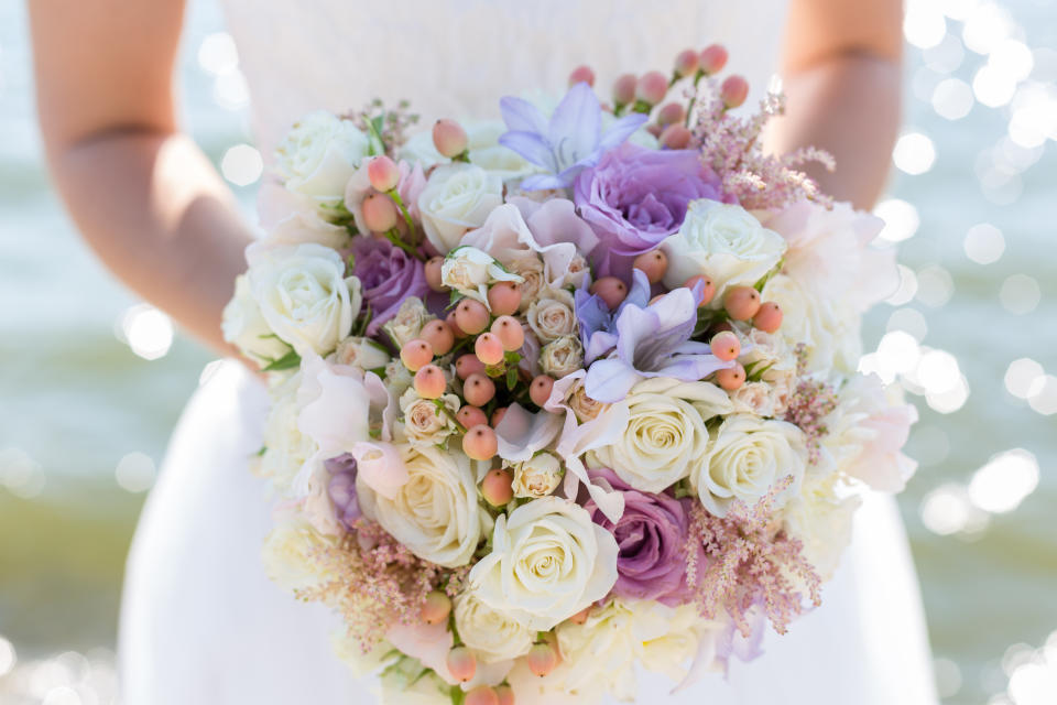 wedding bouquet in hands of the bride