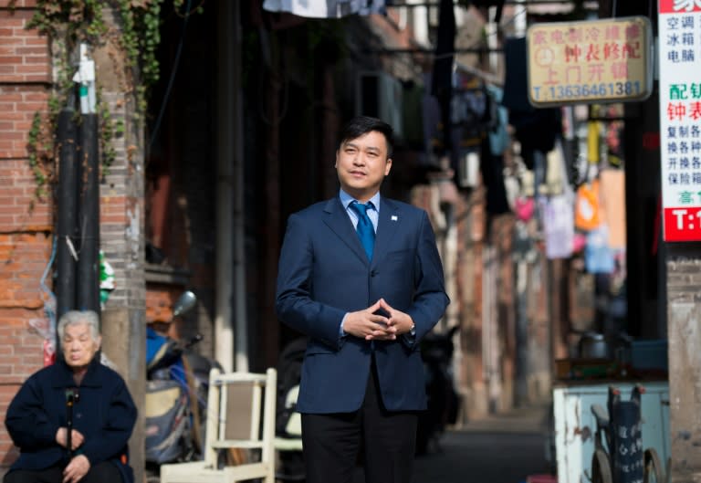 Chen Jian, 33, son of peach farmers, poses for a photo in Shanghai