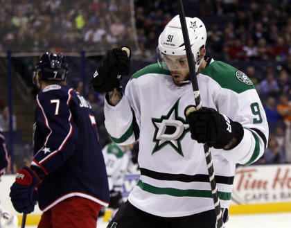 Dallas Stars&#39; Tyler Seguin, right, celebrates his goal in the first period in front of Columbus Blue Jackets&#39; Jack Johnson during an NHL hockey game in Columbus, Ohio, Tuesday, Oct. 14, 2014. Seguin had three goals in the game. Dallas won 4-2. (AP Photo/Paul Vernon)