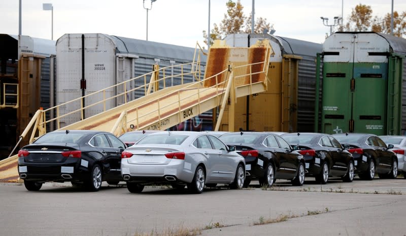 Chevrolet 2019 Impala vehicles sit outside waiting to be loaded on to transport trains outside the General Motors Detroit-Hamtramck Assembly in Hamtramck