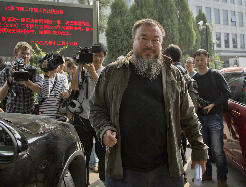 Chinese activist artist Ai Weiwei prepares to leave the Beijing No. 2 People's Intermediate Court, after attending his appeal case in Beijing Thursday, Sept. 27, 2012. Chinese authorities on Thursday rejected Ai’s second appeal of a $2.4 million tax fine, meaning his design company will have to pay the penalty. (AP Photo/Andy Wong)