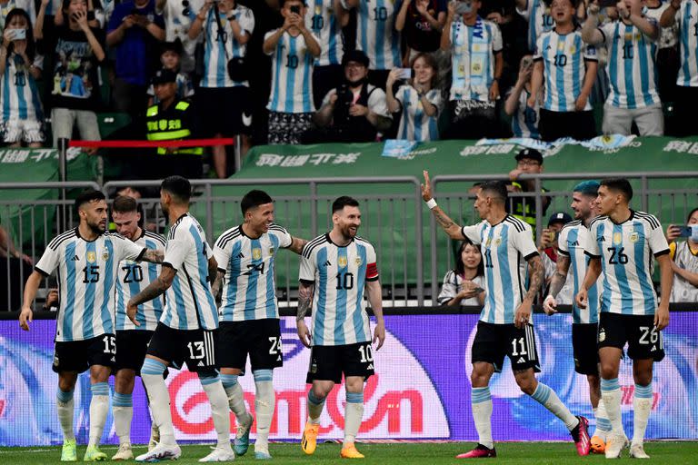 Argentina's Lionel Messi (4R) celebrates with his teammates during a friendly football match against Australia at the Workers' Stadium in Beijing on June 15, 2023. (Photo by Pedro PARDO / AFP)