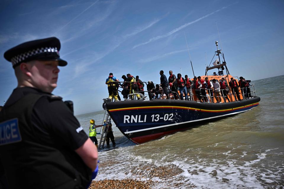 Migrants arrive at Dungeness beach after attempting to cross the Channel on small boats (AFP via Getty Images)