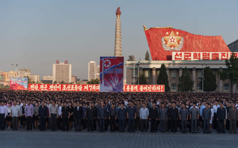 Participants of a mass rally gather on Kim Il-Sung sqaure in Pyongyang on September 23 - Credit: KIM WON-JIN/AFP