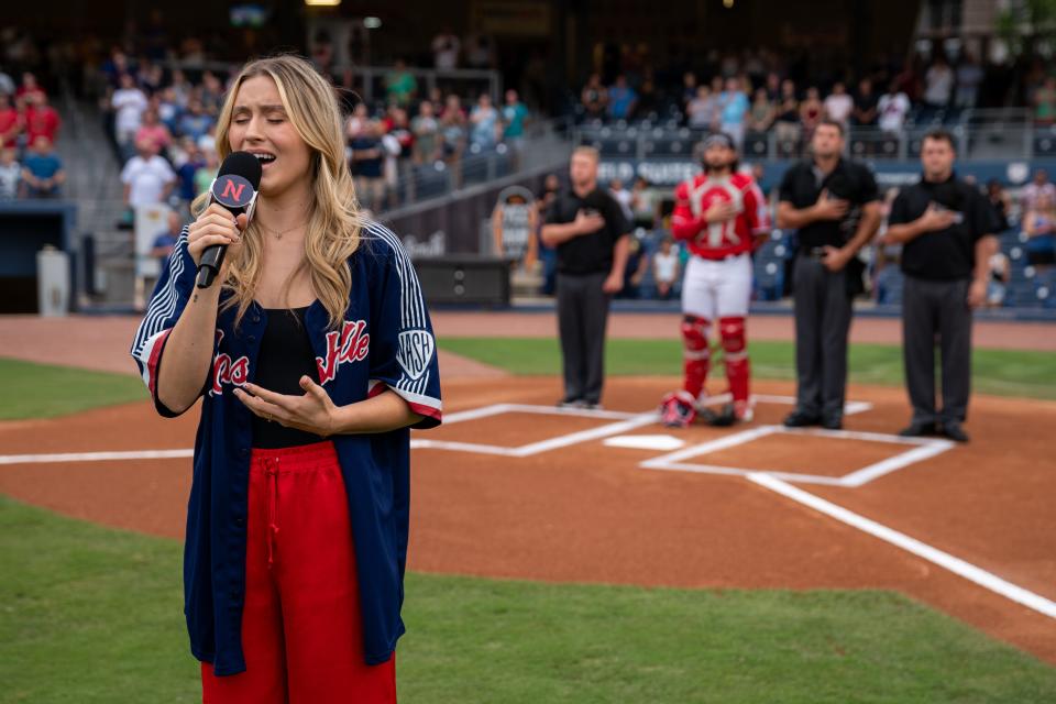 Harper Grace sings the national anthem before a Nashville Sounds game at First Horizon Park in Nashville, Tenn., Friday, July 21, 2023.