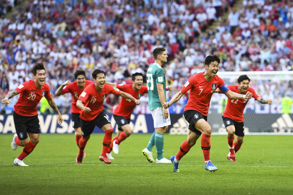 Heung Son-min leads the celebrations after scoring South Korea’s second goal in injury time. (Getty)