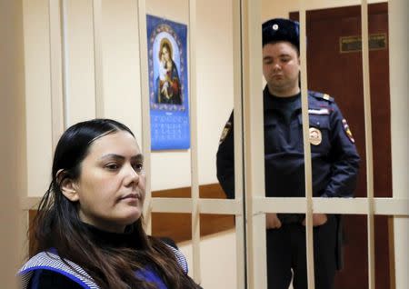 Gulchekhra (Gyulchekhra) Bobokulova, a nanny suspected of murdering a child in her care, sits inside a defendants' cage as she attends a court hearing in Moscow, Russia, March 2, 2016. REUTERS/Maxim Shemetov