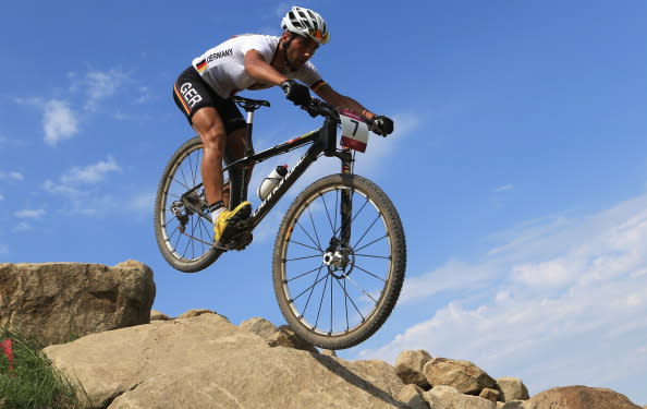 HADLEIGH, ESSEX - AUGUST 12: Manuel Fumic of Germany competes in the Men's Cross-country Mountain Bike race on Day 16 of the London 2012 Olympic Games at Hadleigh Farm on August 12, 2012 in Hadleigh, England. (Photo by Phil Walter/Getty Images)