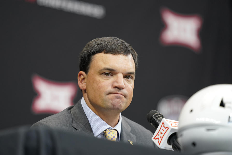 West Virginia head coach Neal Brown listens to a reporter's question at the NCAA college football Big 12 media days in Arlington, Texas, Wednesday, July 13, 2022. (AP Photo/LM Otero)