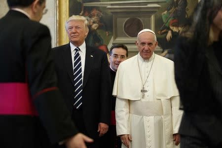 U.S. President Donald Trump stands next to Pope Francis during a private audience at the Vatican, May 24, 2017. REUTERS/Evan Vucci/Pool