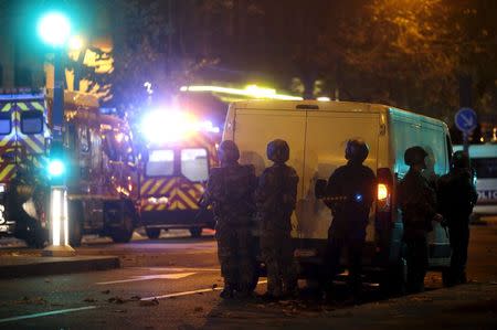 French riot police secure the area near the Bataclan concert hall following a fatal shooting at a restaurant in Paris, France, November 13, 2015. REUTERS/Christian Hartmann