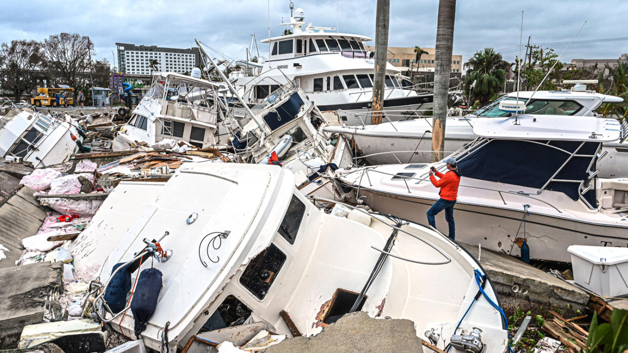 Robert Ray takes photos of a chaotic pileup of damaged vessels.