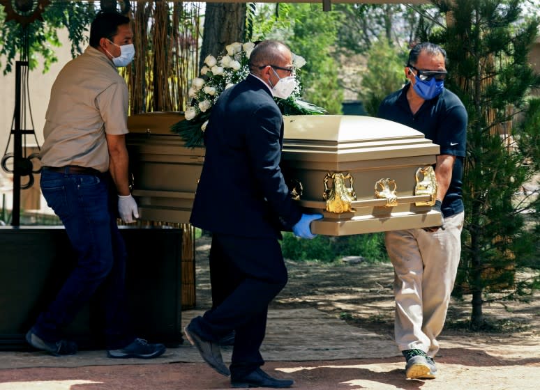 Funeral parlour workers transport the body of Sergio Bretado, 50, a stretcher-bearer from the General Regional Hospital, the 66th victim of COVID-19 of the Mexican Institute of Social Security (IMSS), in Ciudad Juárez, Mexico on May 15, 2020. (Photo by HERIKA MARTINEZ / AFP) (Photo by HERIKA MARTINEZ/AFP via Getty Images)