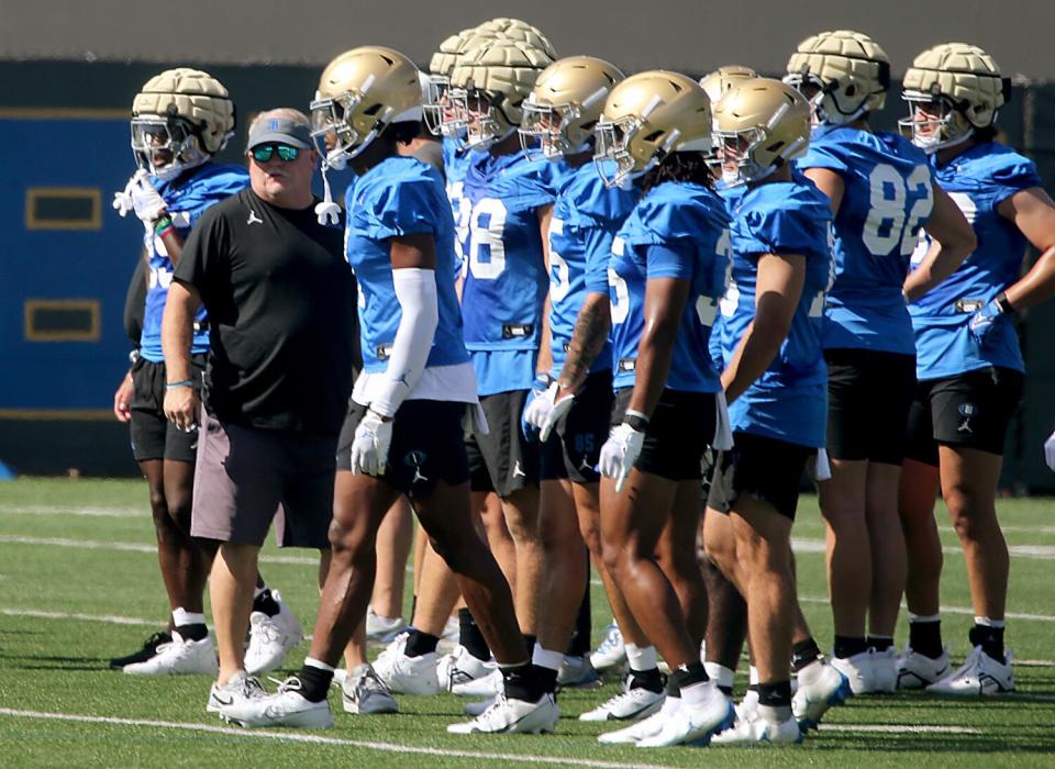 UCLA coach Chip Kelly watches players during practice at Spaulding Field on Aug. 2.