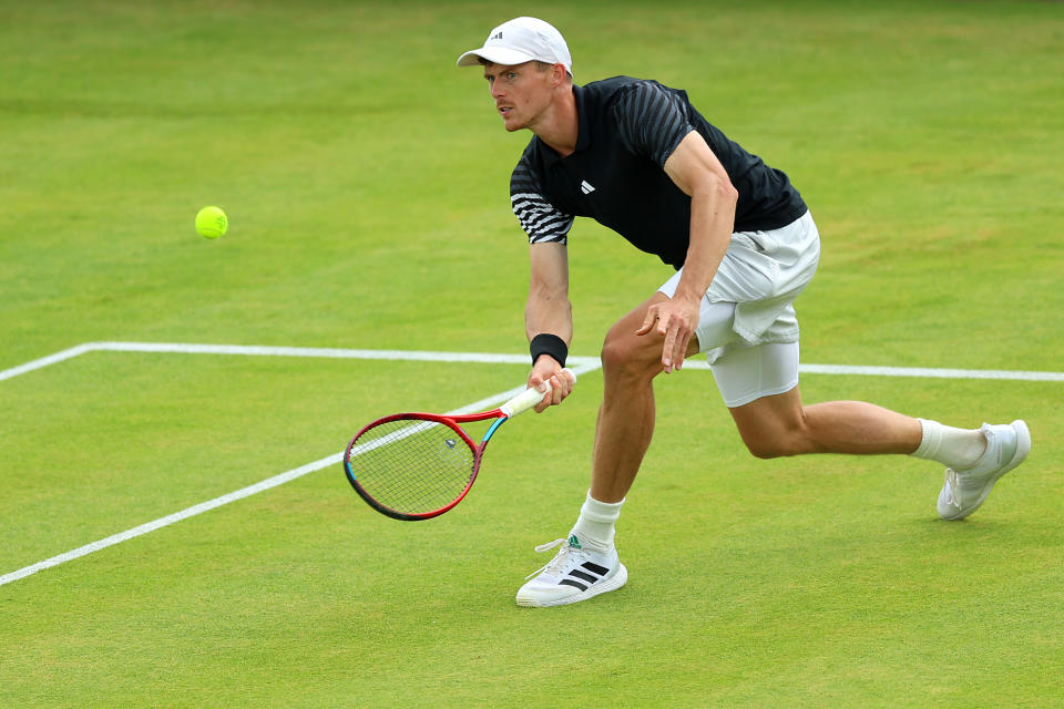 LONDON, ENGLAND - JUNE 18: Billy Harris of Great Britain plays a forehand against Tomas Martin Etcheverry of Argentina during the Men's Singles Round of 32 match on Day Two of the cinch Championships at The Queen's Club on June 18, 2024 in London, England. (Photo by Luke Walker/Getty Images for LTA)