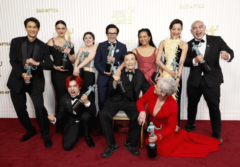 Harry Shum Jr., Jenny Slate, Andy Le, Tallie Medel, Ke Huy Quan, James Hong, Stephanie Hsu, Jamie Lee Curtis, Michelle Yeoh and Brian Le, recipients of the Outstanding Performance by a Cast in a Motion Picture award for "Everything Everywhere All at Once"