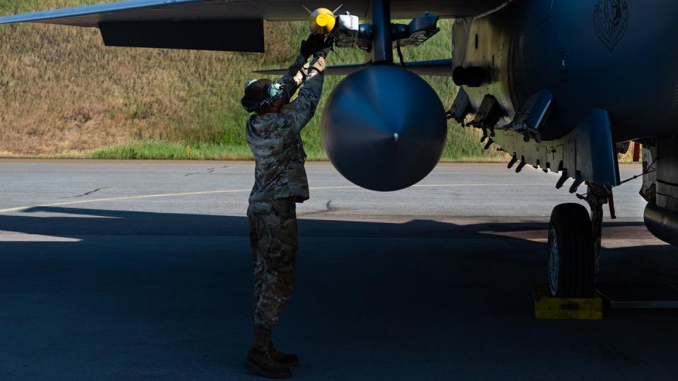 U.S. Air Force Senior Airman Terrance Middleton, 494th Fighter Generation Squadron electrical systems journeyman, prepares an F-15E Strike Eagle for takeoff during Arctic Challenge Exercise 2023 at Pirkkala, Finland, June 7. (Staff Sgt. Gaspar Cortez/Air Force)