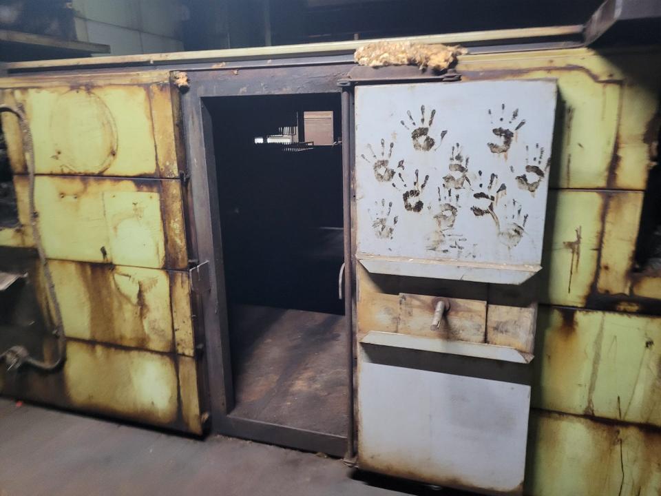 These mysterious prints, approximately the size of a child's hand, are on the inside of a door leading to an old drying machine inside Saxonville Mills.