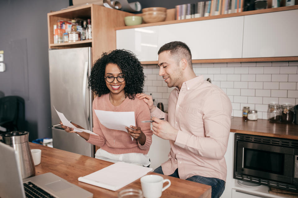 Couple planning their finances on the kitchen