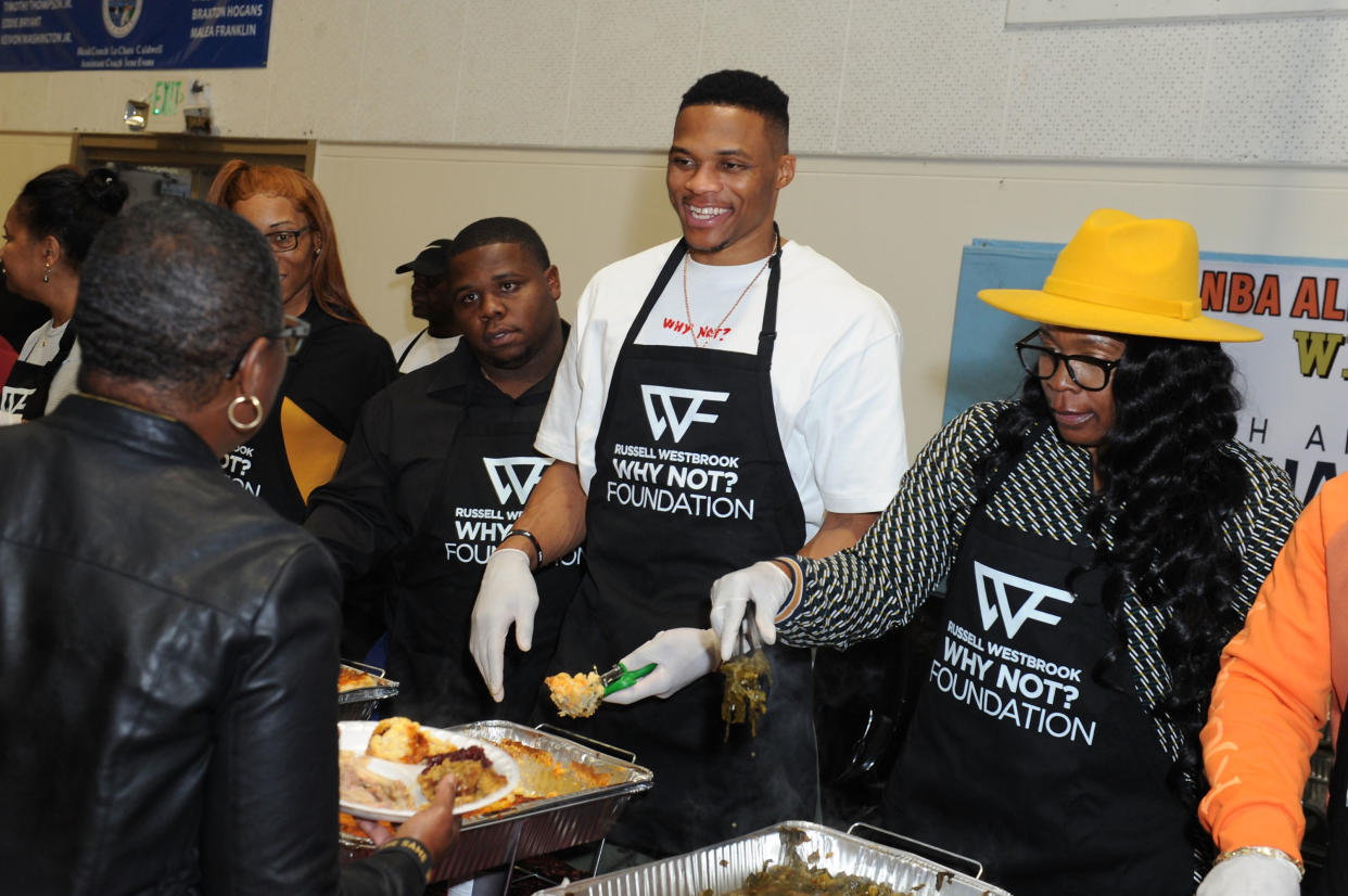 LOS ANGELES, CA - NOVEMBER 21: (L-R) Raynard Westbrook, Russell Westbrook and Shannon Westbrook attend Russell Westbrook Why Not? Foundation 8th Annual Thanksgiving Dinner at Jesse Owens Community Regional Park on November 21, 2019 in Los Angeles, California.  (Photo by Joshua Blanchard/Getty Images for Russell Westbrook Why Not? Foundation )