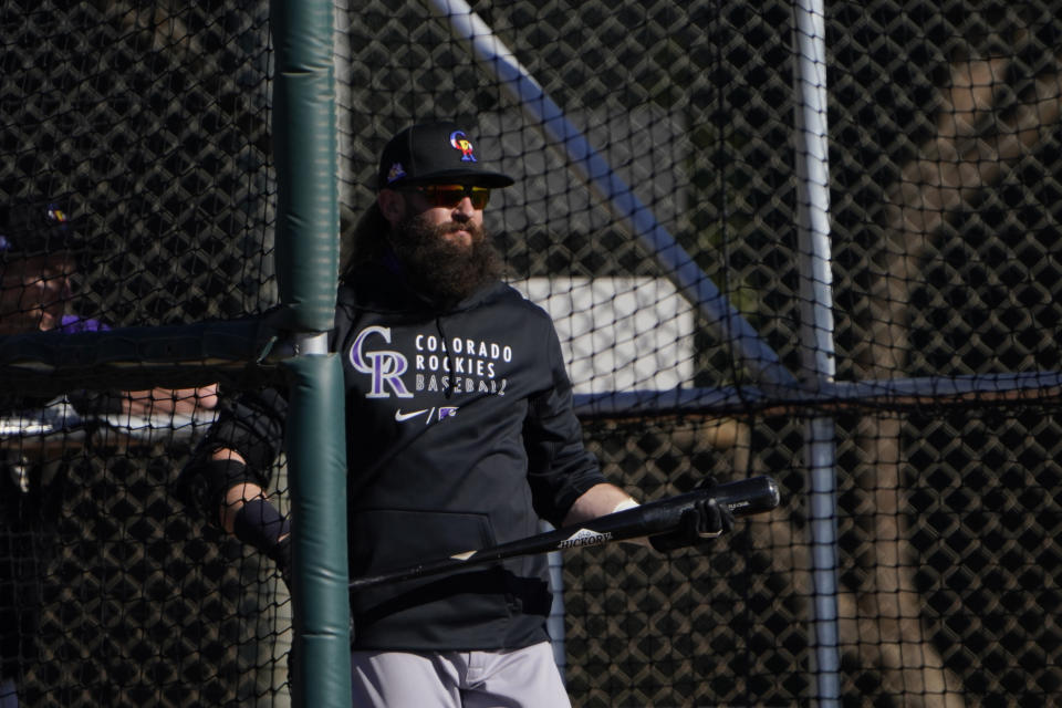 Colorado Rockies' Charlie Blackmon walks out of a batting case during the team's spring training baseball workout in Scottsdale, Ariz., Wednesday, Feb. 24, 2021. (AP Photo/Jae C. Hong)