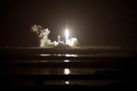 A SpaceX Falcon Heavy rocket, carrying the U.S. Air Force's Space Test Program 2 Mission, lifts off from the Kennedy Space Center in Cape Canaveral, Florida