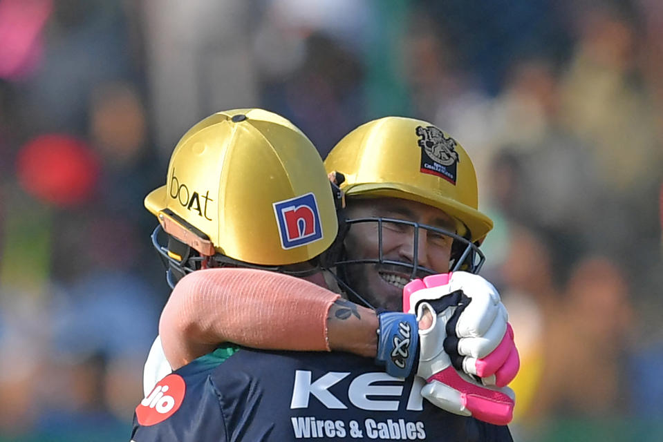 Seen here, Royal Challengers Bangalore's Faf du Plessis and Glenn Maxwell celebrating their 100-run partnership in the IPL cricket match against Rajasthan Royals.