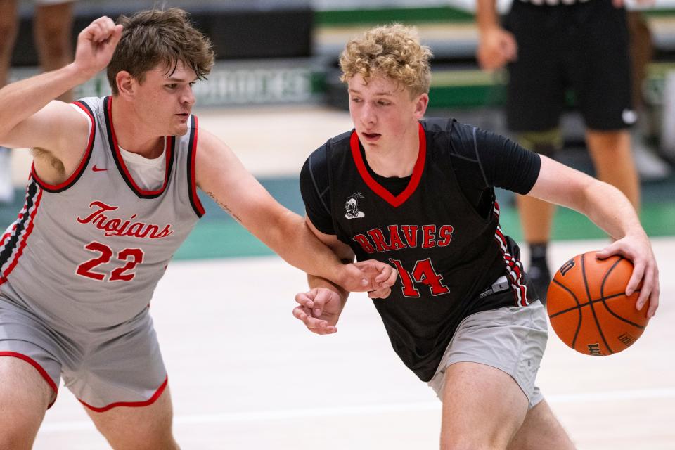 Brownstown Central High School's Jack Benter (14) drives the ball toward the basket during Charlie Hughes Shootout basketball action, Saturday, June 24, 2023, at Westfield High School.