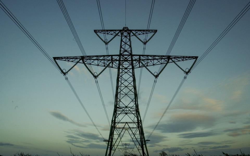 GLASTONBURY, UNITED KINGDOM - FEBRUARY 05: Electricity pylons carry electrical cables across fields on February 05, 2023 near Glastonbury, England.  The UK government has released documents with plans for Britain to go 'lights out' this winter after the National Grid warned there could be power cuts due to the ongoing energy crisis.  There are fears that Russian President Vladimir Putin will restrict Europe's gas supply and although the UK is not dependent on Russian energy supplies, it does import electricity and gas from European countries that supply it. make.  With many consumers already facing a cost of living crisis with a sharp rise in their home energy bills, power outages are expected to add to their misery this winter.  (Photo by Matt Cardy/Getty Images) - Matt Cardy/Getty Images